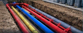 Illustrative multi-service pipework and ducting inside a trench